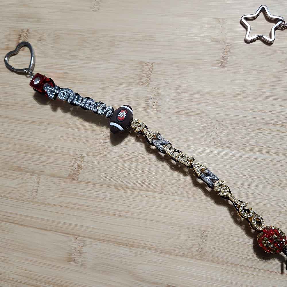 Gold and Silver Charm Bracelet with Red Accents